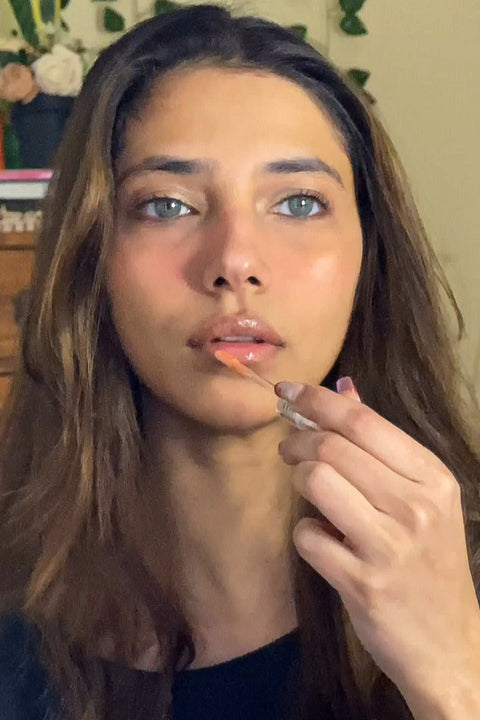 Swipe the lip glaze evenly across your lips.